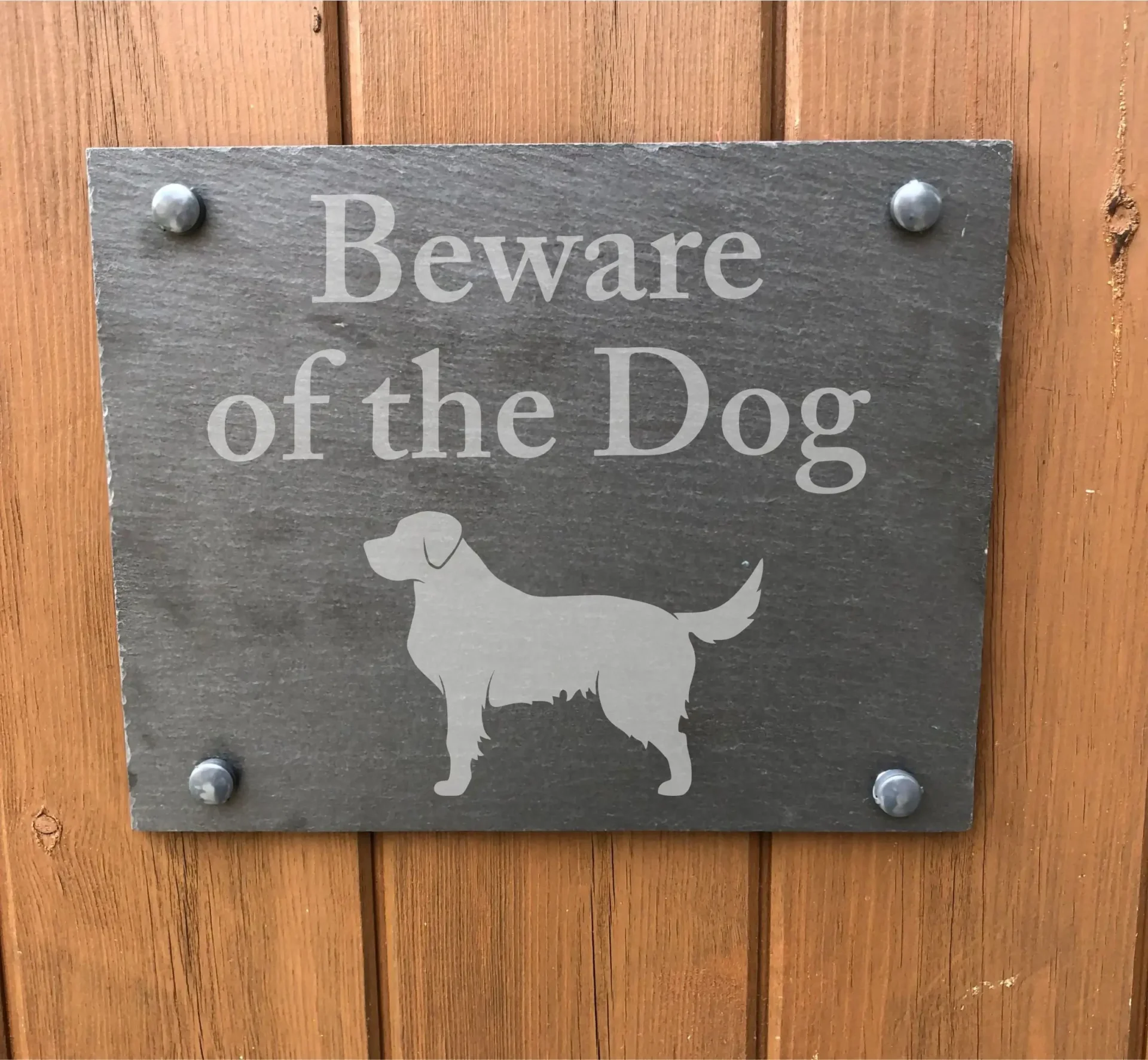 A sign that says beware of the dog