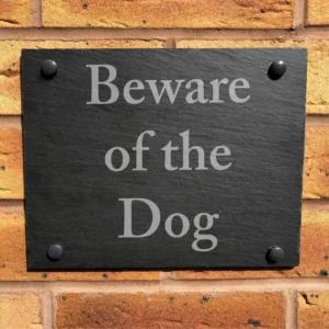 A sign that says beware of the dog