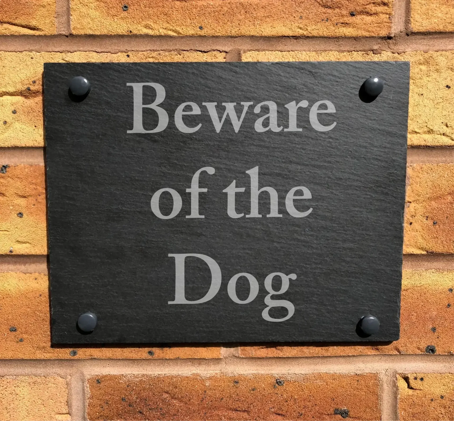 A sign that says beware of the dog