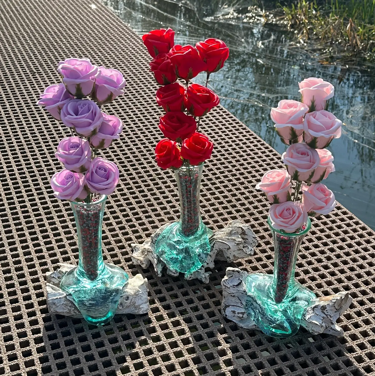 Three vases with flowers on a table