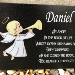 A plaque with an angel holding a horn.
