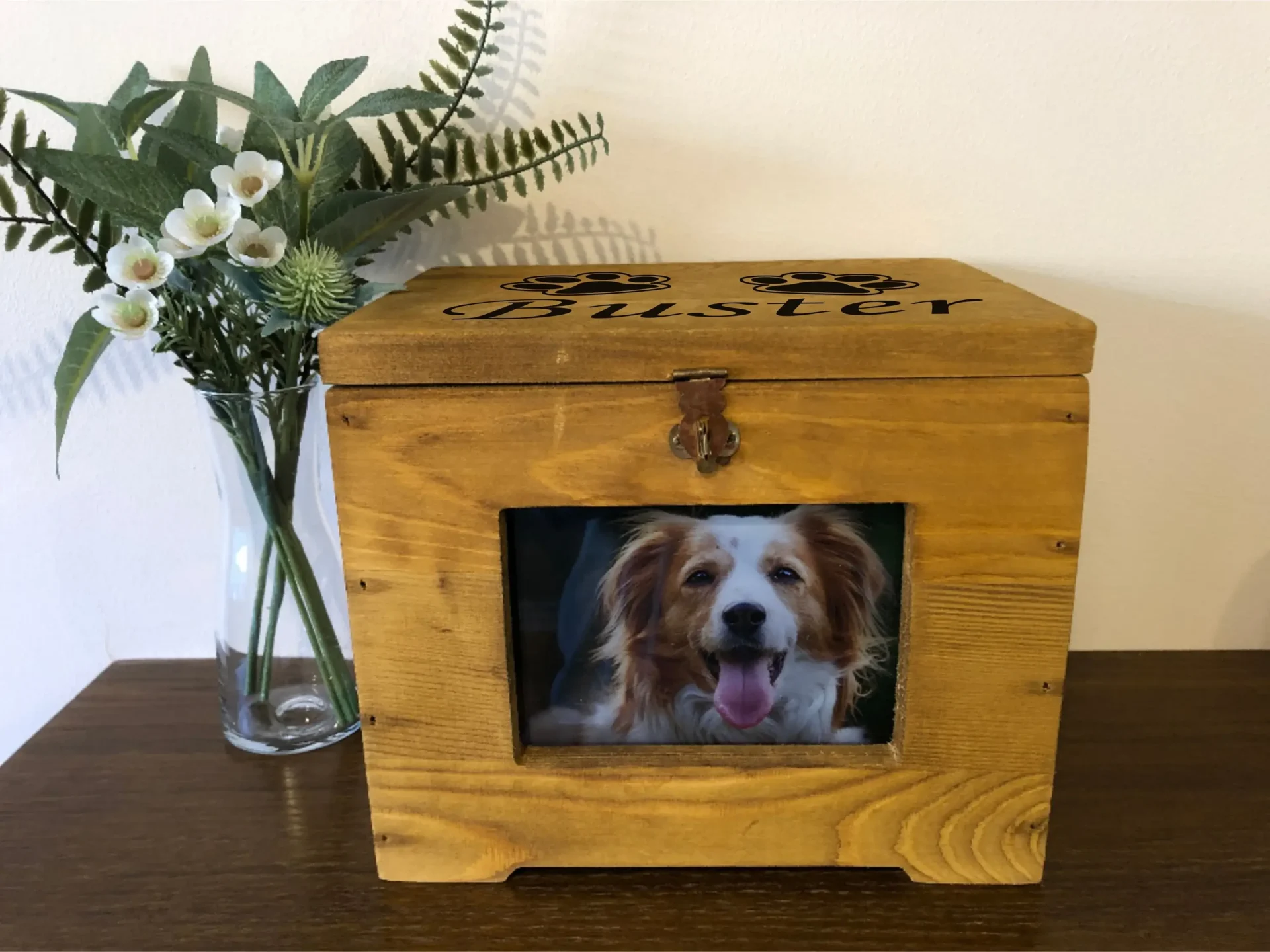 A wooden box with a picture of a dog in it.