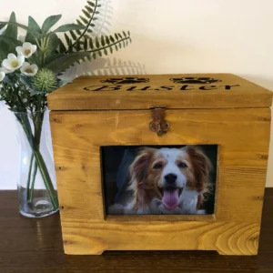 A wooden box with a picture of a dog in it.