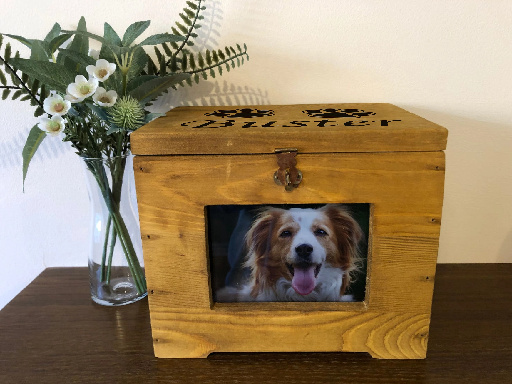 A wooden box with a picture of a dog in it.