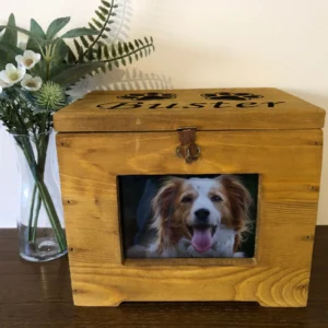 A wooden box with a picture of a dog in it.