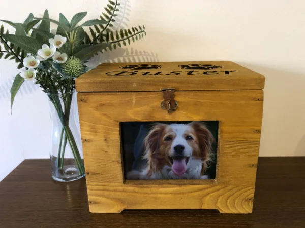 A wooden box with a picture of a dog in it.