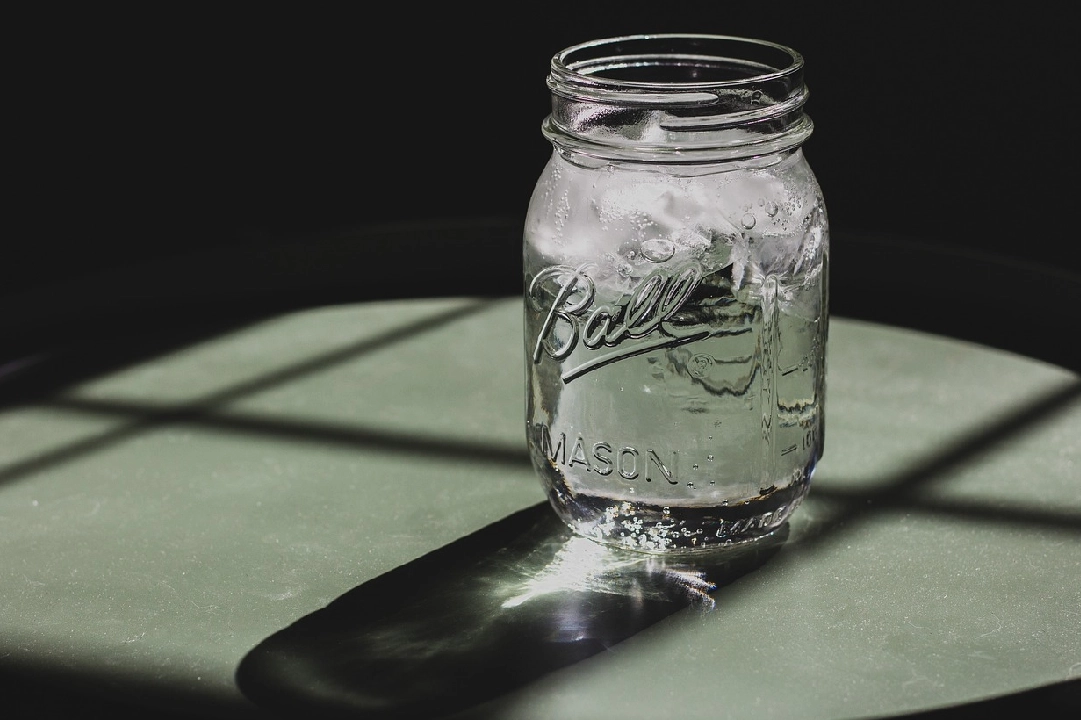 A mason jar sitting on top of a table.